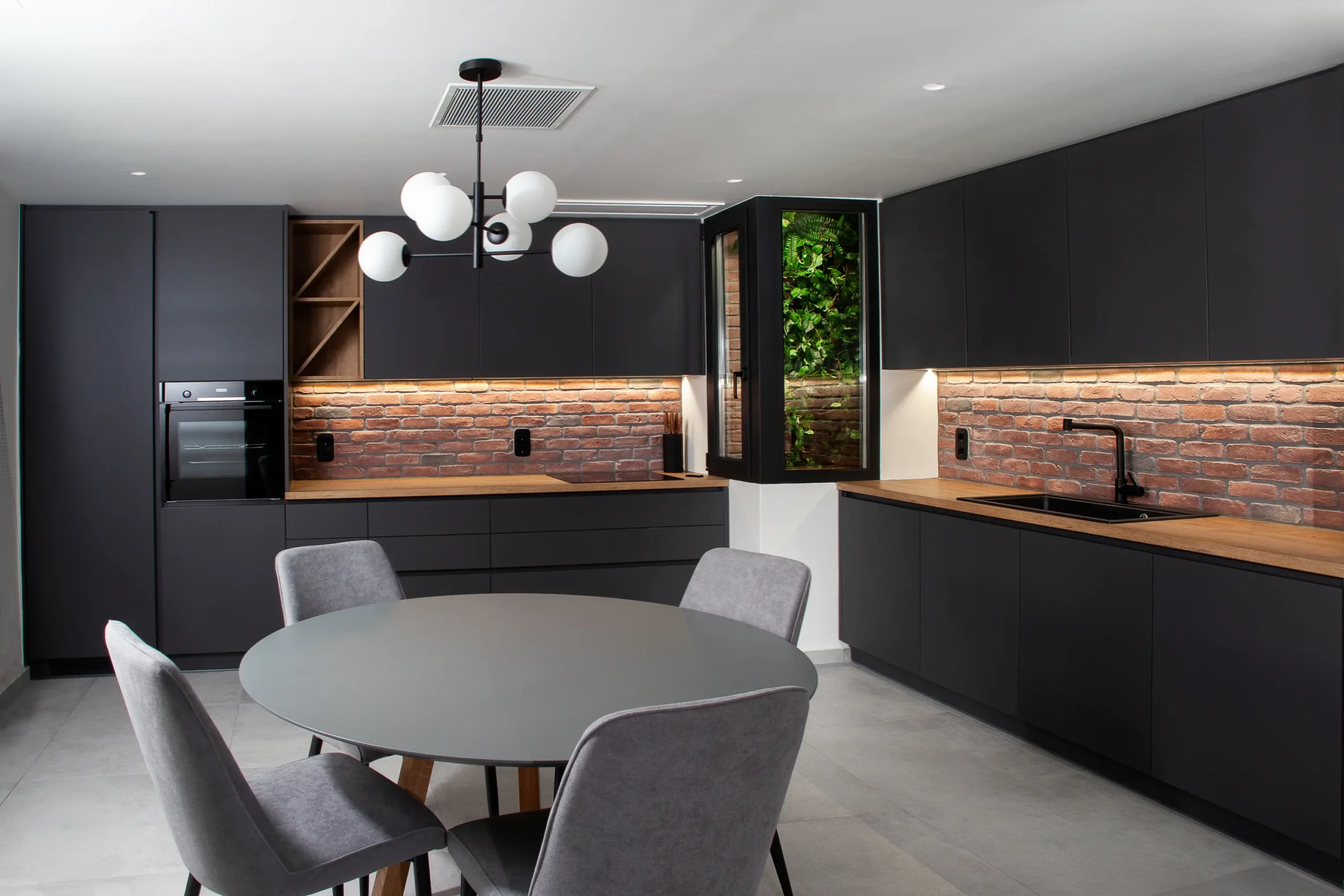 Interior view of the kitchen and dining area in the apartment building on Korai Street, designed by XG Group of Engineers.